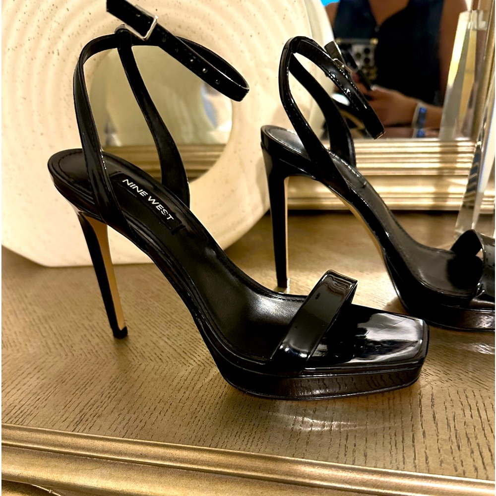 Black patent leather slings. Worn once and are in perfect condition.